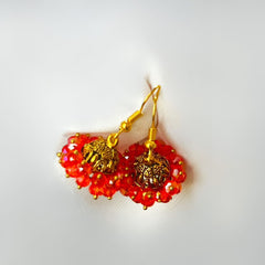 Orange Beaded Golden Jhumka Earrings